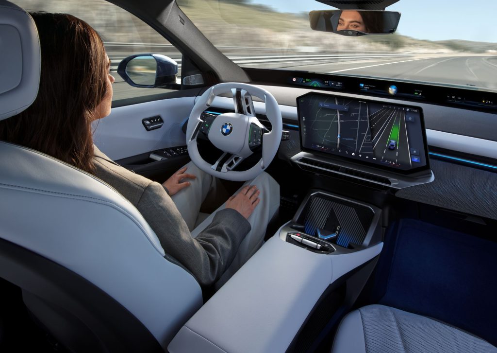Digital cockpit of the BMW iX3 as Qualcomm is advancing its connected car efforts, revealing a string of deals with household names like Google, BMW, and Mercedes-Benz with a new generation of in-car AI powered by Snapdragon and technologies like the Gemini AI models.