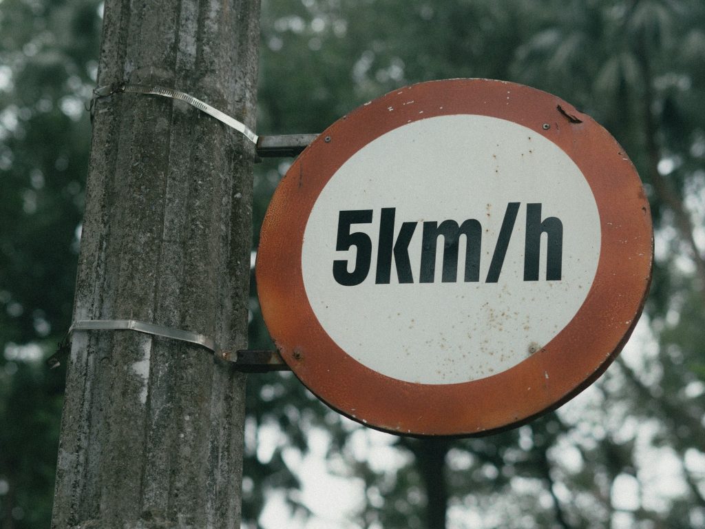 Speed limit traffic sign as new research answers how many self-driving cars one human safely keep an eye on.
