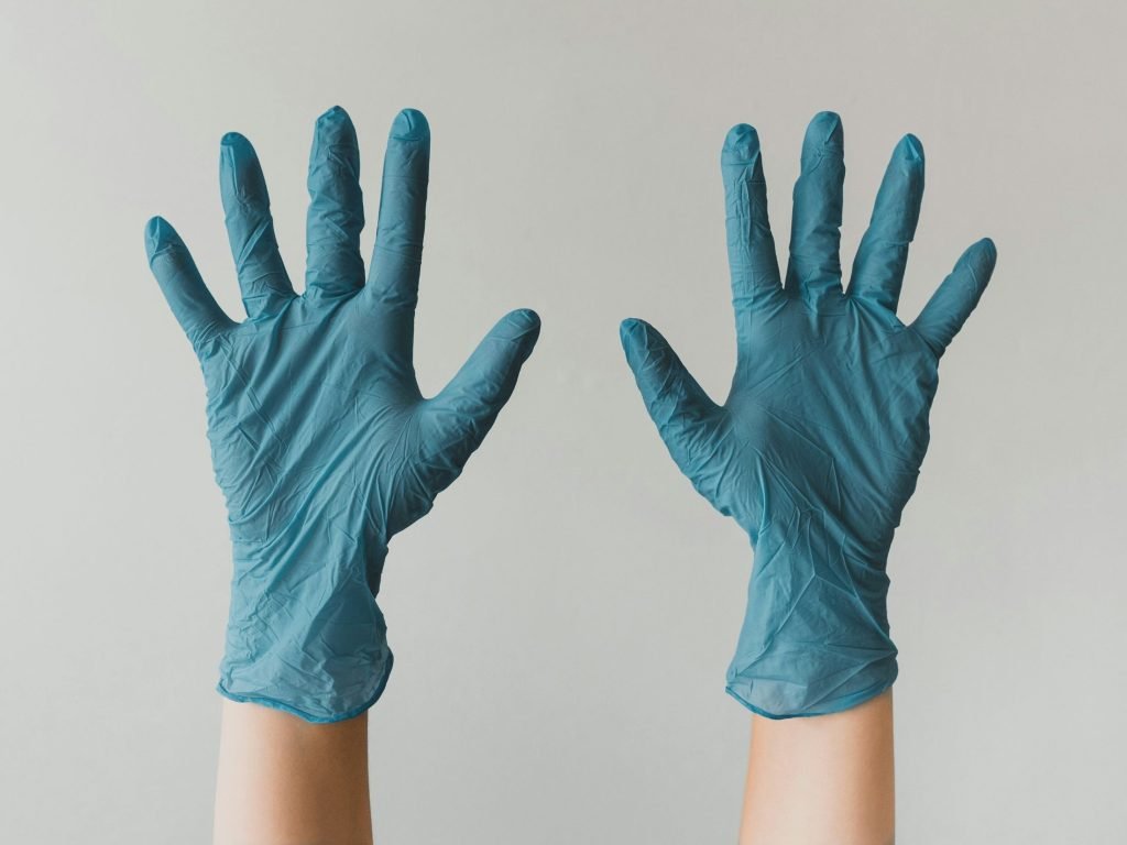 Person holding up hands in medical gloves as vast amounts of data from wearables and digital wellness apps currently seldom informs health diagnostics or treatment in a meaningful way, but that could be about the change thanks to a partnership between virtual healthcare provider HealthTap and Samsung Health.
